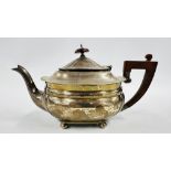 A SILVER TEAPOT,