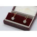 A PAIR OF VINTAGE 9CT GOLD DIAMOND CLUSTER EARRINGS.
