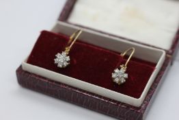 A PAIR OF VINTAGE 9CT GOLD DIAMOND CLUSTER EARRINGS.