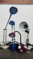 A GROUP OF FOUR ADJUSTABLE AND ANGLE POISED DESK LAMPS - SOLD AS SEEN.