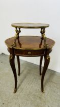 A REPRODUCTION ITALIAN STYLE GILT EMBELLISHED OVAL TWO TIER OCCASIONAL TABLE.