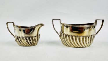 A VICTORIAN SILVER TWO HANDLED SUGAR BASIN AND CREAM JUG, SHEFFIELD 1889, MAKER HENRY HARRISON.