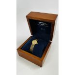 A ROTARY ELITE 9CT GOLD CASED WRIST WATCH ON A 9CT GOLD BRACELET STRAP (BOXED).