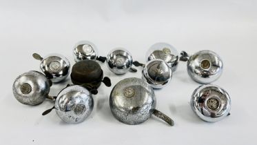 A COLLECTION OF 11 VARIOUS BICYCLE BELLS TO INCLUDE LUCAS, TOMBAR, KING OF THE ROAD, ETC.