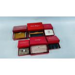 A GROUP OF 6 BOXED DESIGNER PURSES MARKED "SALVADOR FERRAGAMA".