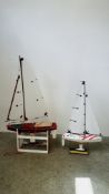 TWO RC SAILING BOATS ON STANDS (NO CONTROLLER).