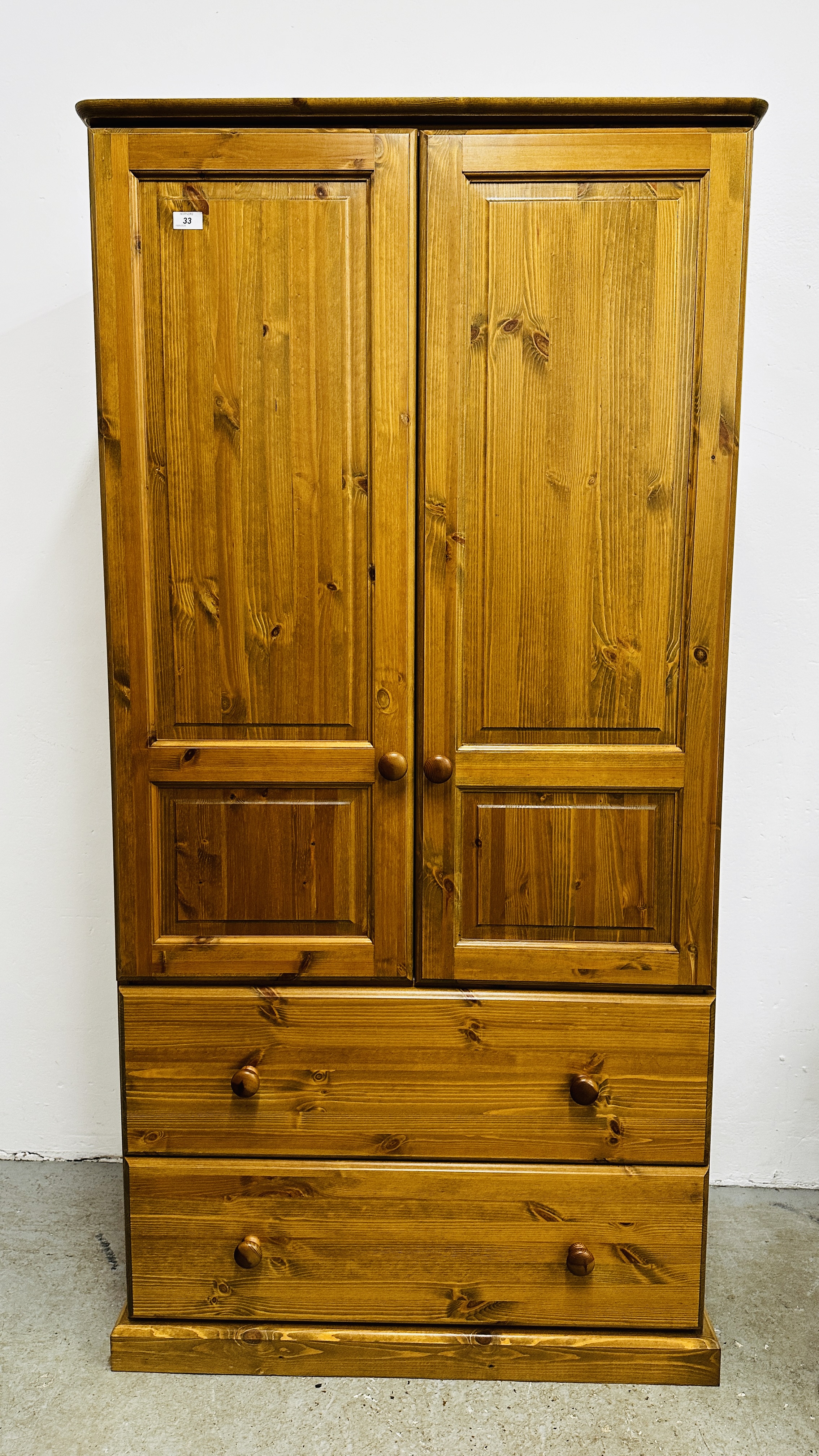 A SOLID PINE TWO DRAWER DOUBLE WARDROBE, W 90CM X D 53CM X H 179CM.