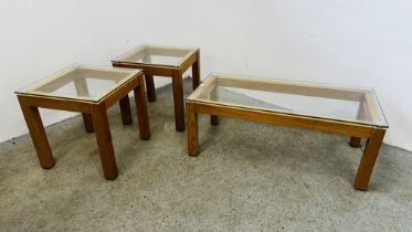 A MODERN SOLID LIGHT OAK FRAMED RECTANGULAR COFFEE TABLE WITH GLASS TOP L 107 X W 51 ALONG WITH A