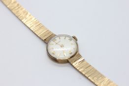 A VERTEX LADY'S WRISTWATCH, THE CASE AND BRACELET 9CT GOLD (MINOR DAMAGE TO BRACELET).