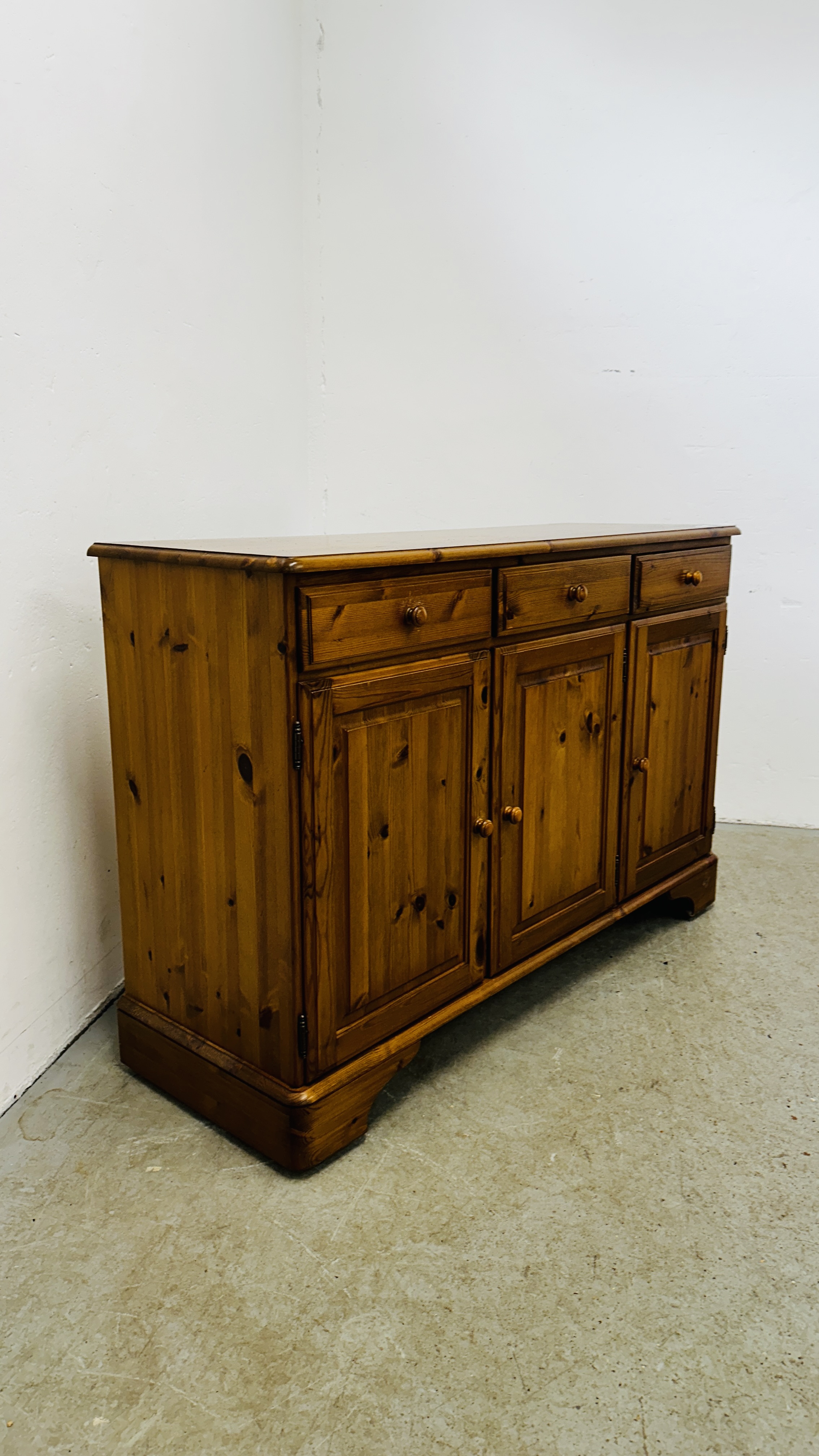 A DUCAL HONEY PINE THREE DRAWER THREE DOOR DRESSER BASE - Image 3 of 11