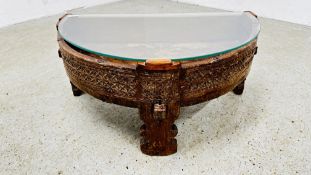 A VINTAGE EASTERN HARD WOOD HALF MOON COFFEE TABLE WITH GLASS TOP W 74 X D 43 X H 32.5CM.