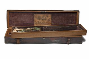 COGSWELL & HARRISON A BRASS-CORNERED OAK AND LEATHER TWO-TIER SINGLE GUNCASE, fitted for 30in.