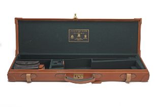 JAMES PURDEY & SONS A LEATHER SINGLE OVER AND UNDER GUNCASE, fitted for 30in. barrels, the