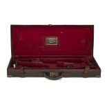 A BRASS-CORNERED LEATHER DOUBLE GUNCASE, fitted for 28in. barrels (could adapt to 30in.), the
