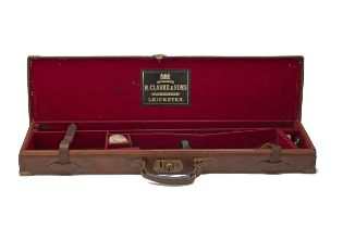 H. CLARKE & SONS A BRASS-CORNERED LEATHER SINGLE GUNCASE, fitted for 30in. barrels, the interior