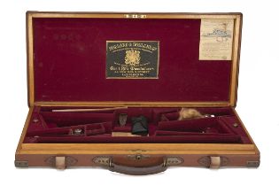 HOLLAND & HOLLAND A BRASS-CORNERED OAK AND LEATHER DOUBLE GUNCASE, fitted for 26in. barrels (could