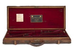 JAMES PURDEY & SONS A BRASS-CORNERED OAK AND LEATHER DOUBLE GUNCASE, fitted for 30in. barrels, the