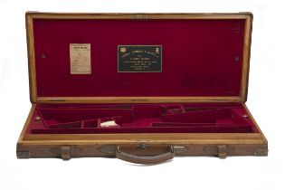 JAMES PURDEY & SONS A BRASS-CORNERED OAK AND LEATHER DOUBLE GUNCASE, fitted for 29in. barrels, the