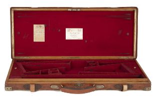 JAMES PURDEY & SONS A BRASS-CORNERED OAK AND LEATHER DOUBLE GUNCASE, fitted for 28in. barrels (could