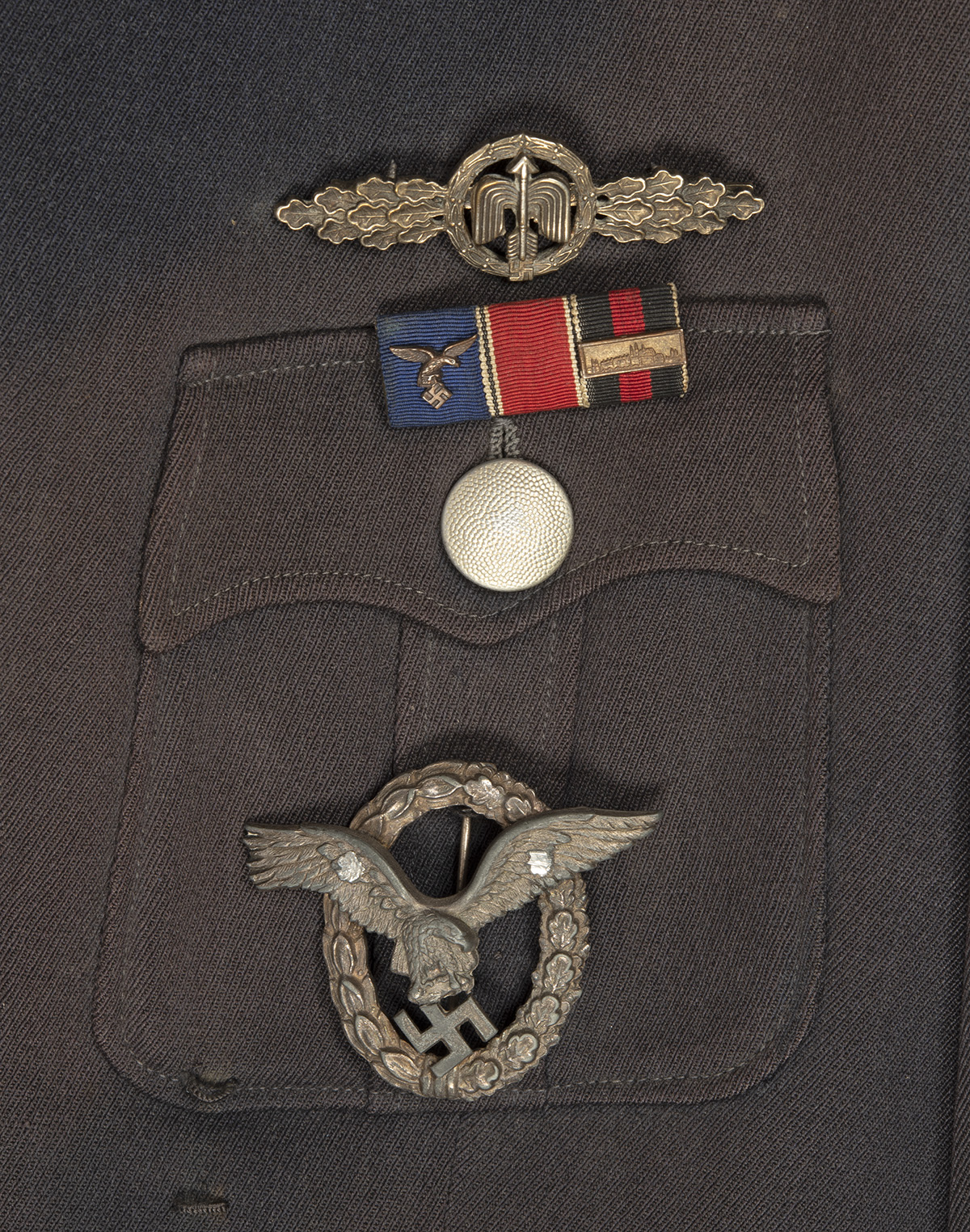 A GERMAN WORLD WAR TWO TUNIC AND PEAKED-CAP FOR AN OBERLEUTNANT IN THE LUFTWAFFE, Airforce blue with - Image 6 of 6