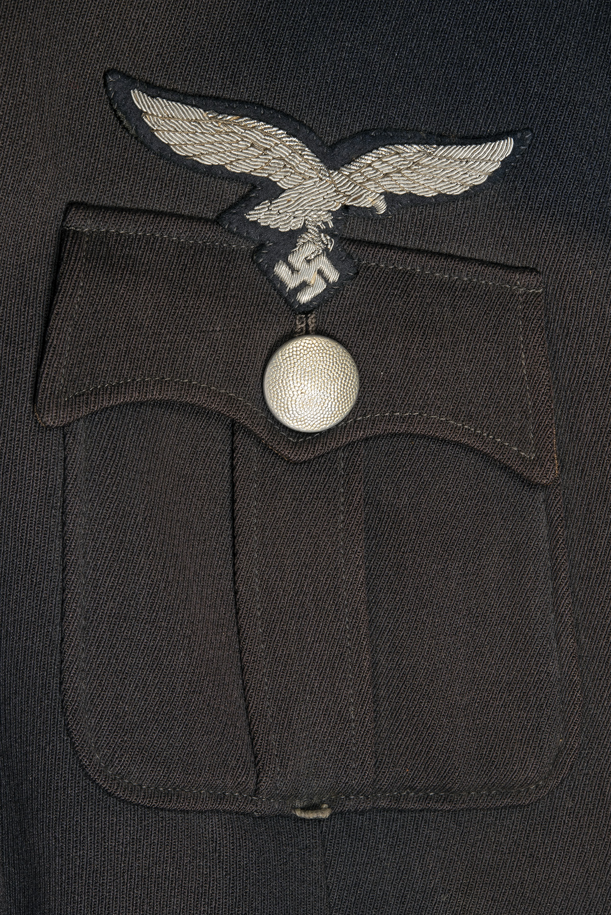 A GERMAN WORLD WAR TWO TUNIC AND PEAKED-CAP FOR AN OBERLEUTNANT IN THE LUFTWAFFE, Airforce blue with - Image 5 of 6