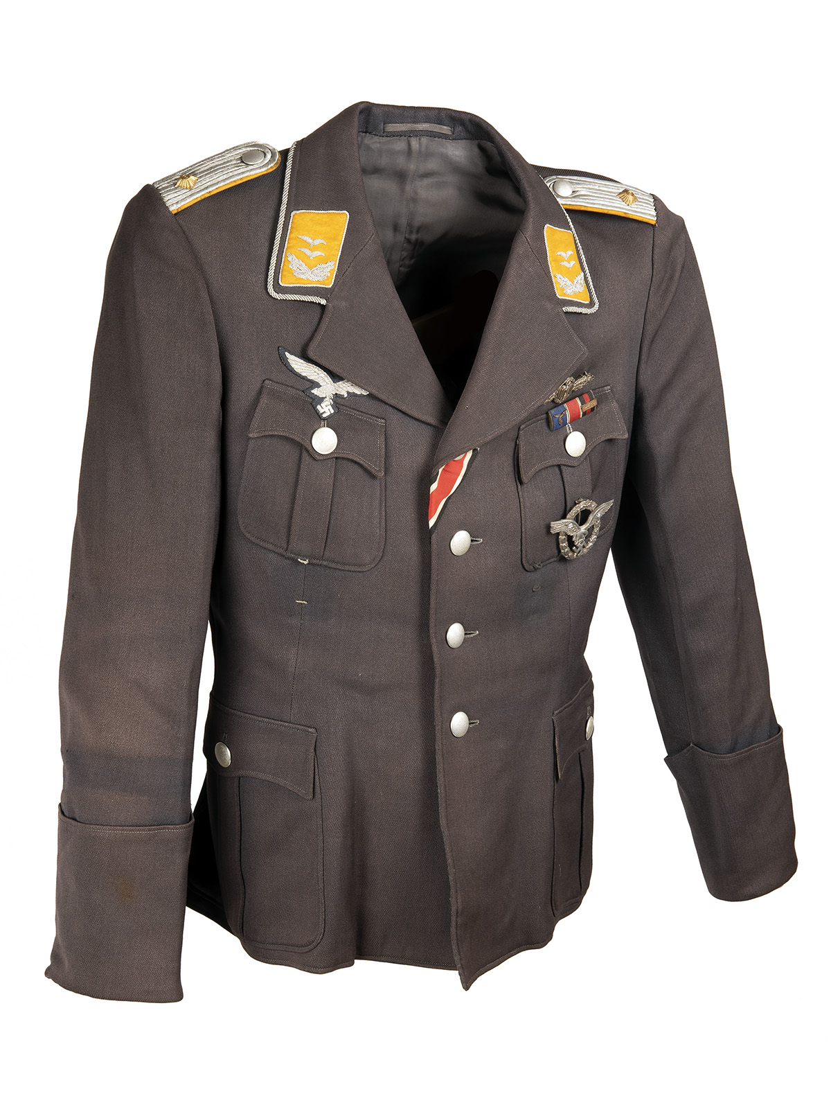 A GERMAN WORLD WAR TWO TUNIC AND PEAKED-CAP FOR AN OBERLEUTNANT IN THE LUFTWAFFE, Airforce blue with