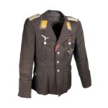 A GERMAN WORLD WAR TWO TUNIC AND PEAKED-CAP FOR AN OBERLEUTNANT IN THE LUFTWAFFE, Airforce blue with