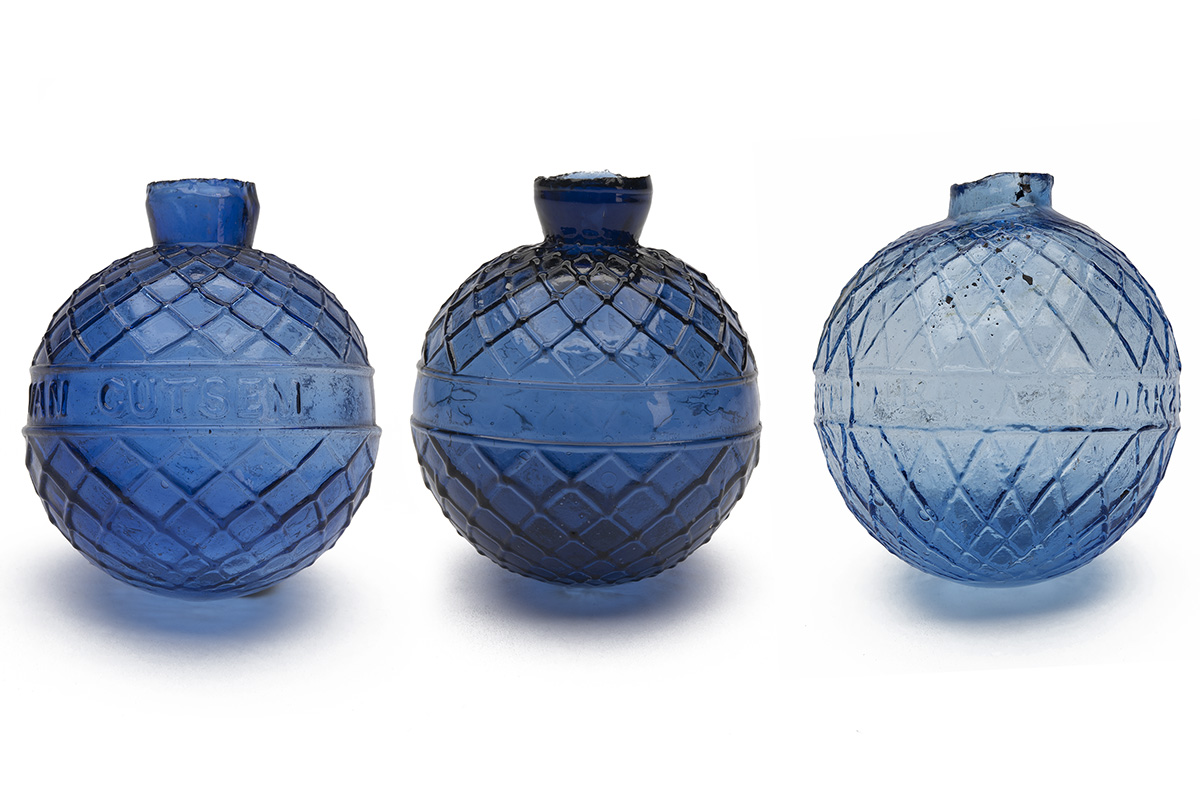THREE LATE VICTORIAN GLASS TARGET BALLS OF BOGARDUS TYPE, all circa 1890, the first a pale blue