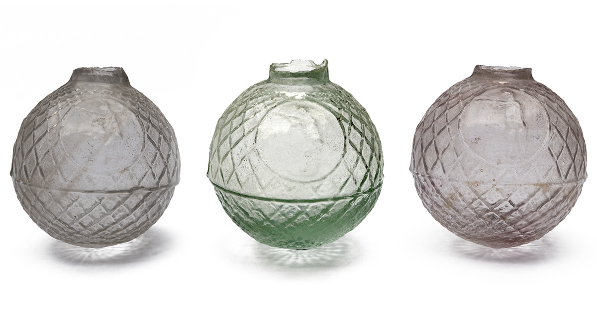 THREE LATE VICTORIAN GLASS TARGET BALLS OF BOGARDUS TYPE, all circa 1890, each of a similar style