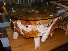 A driftwood beachcomber coffee table with circular