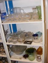 A large quantity of assorted glass - on three shel