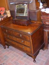 An antique walnut chest of two short and two long