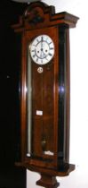 A walnut cased Vienna regulator style wall clock w