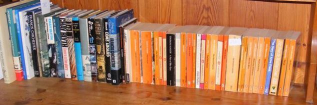 A selection of hardback and paperback books, inclu