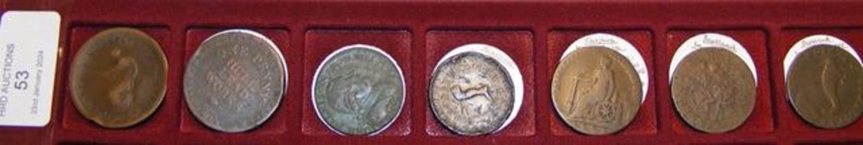 Seven assorted token coins including 1 penny Hull