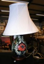 A Moorcroft Pottery table lamp - 26cms high