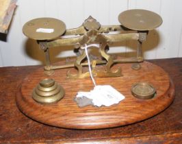 A set of old postal scales with weights