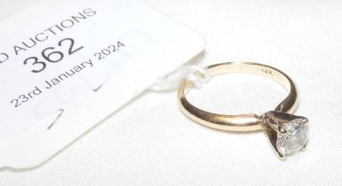 A diamond solitaire ring in gold setting (approx.