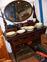 A Victorian mahogany dressing chest with oval swin