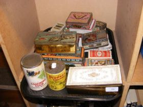 A collection of vintage cigarette tins and boxes,