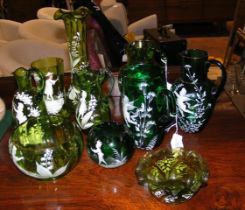A selection of Mary Gregory green glass vases and