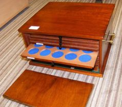 A fourteen tray mahogany lockable portable coin co