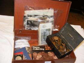 A suitcase containing various collectable coinage,