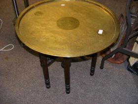 A brass campaign table with Egyptian motif