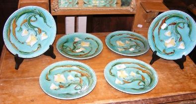 A set of six Majolica plates with tube lined Art N