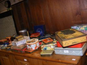 A collection of vintage product tins including tea