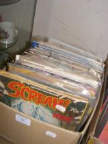 A box of assorted comics