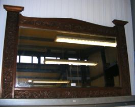 A carved Scottish oak overmantel mirror with thist