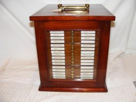 A twenty-one tray antique mahogany coin collector'