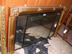 A large decorative gilt over mantel mirror - 147cm